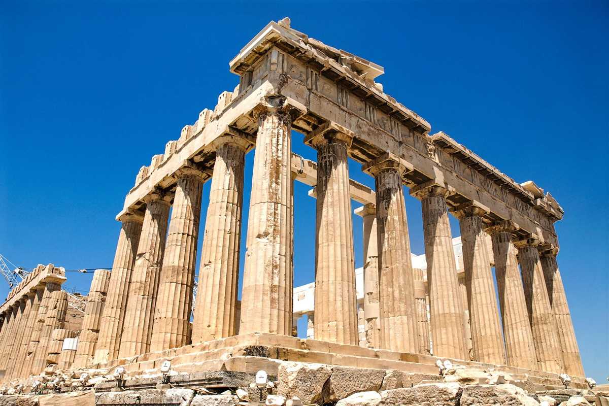 Greece tours: the Parthenon on the Acropolis of Athens seen from a low corner, tall golden Doric columns and the stone beams above them against a deep blue cloudless sky